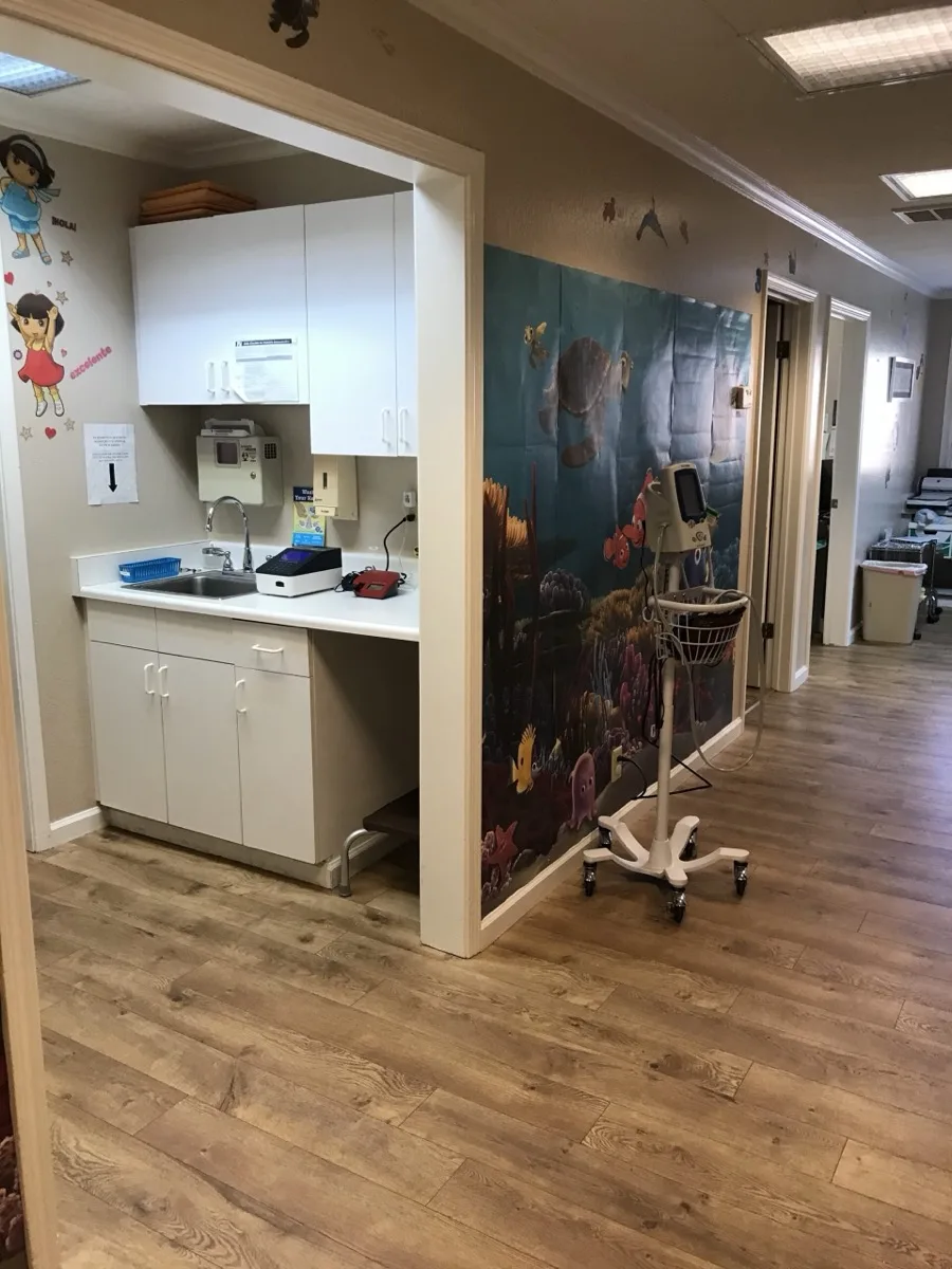 Office hallway with an undersea reef wall mural and nurse station